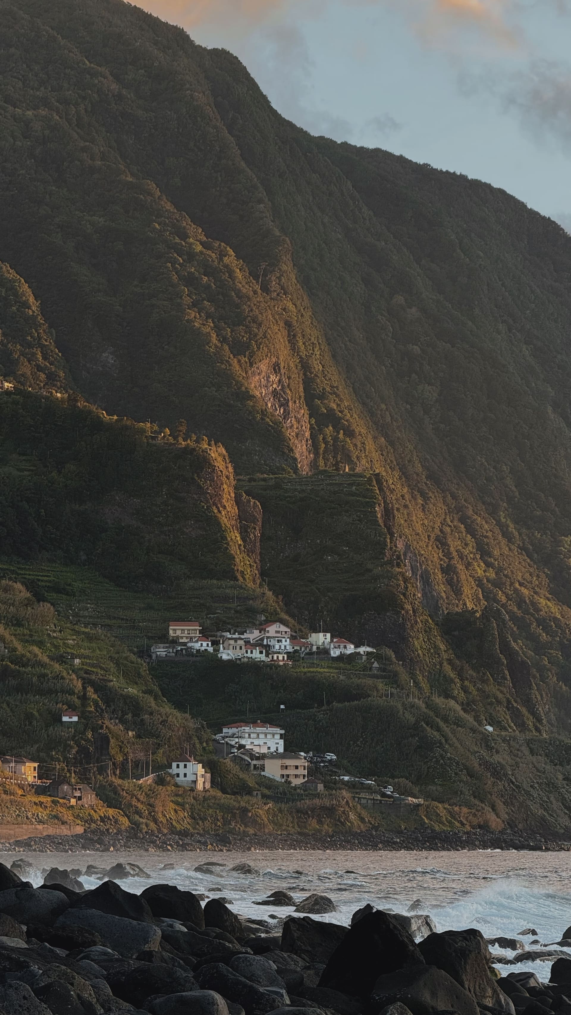 Golden hour light on the mountain village of São Vicente tucked into Madeira's north-coast cliffs, photographed by the EARTH founders.